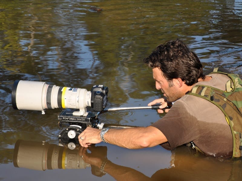 Camera operator uses Canon long lens