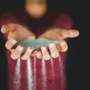 Sand falling through fingers
