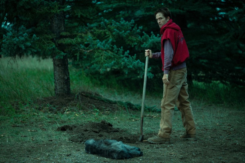 Jackson digging a hole for his dog in Die My Love